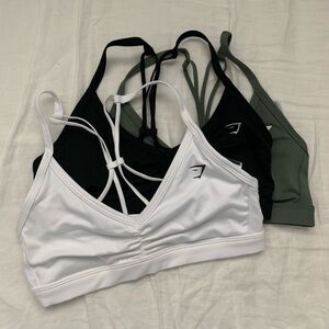 Ruched strappy sports bra in white, black, green